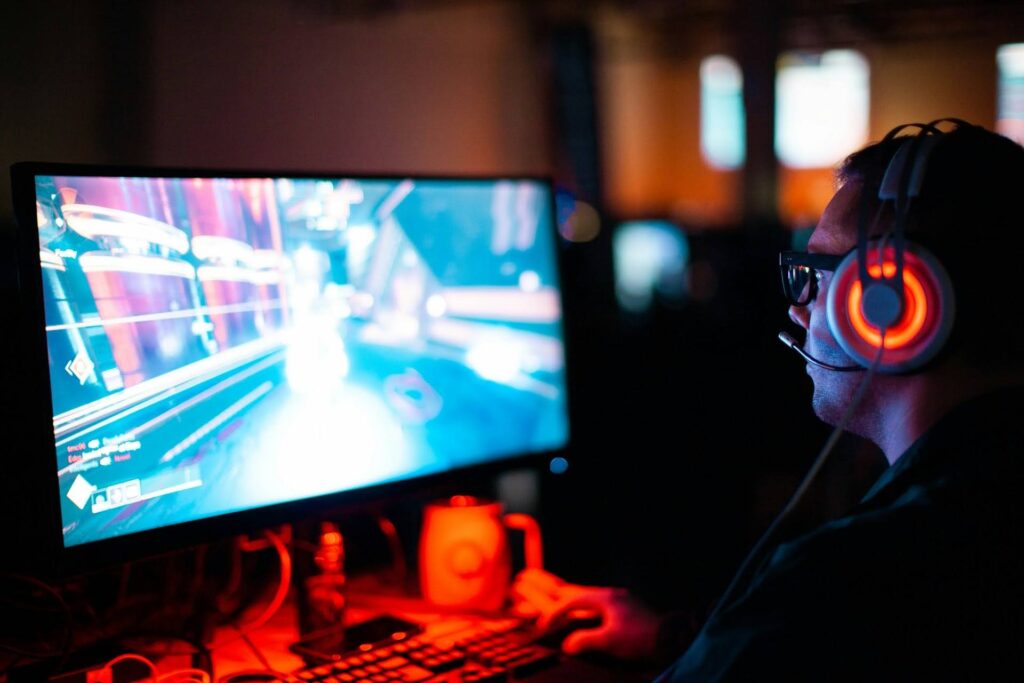 A game developer testing a video game for quality assurance to ensure smooth gameplay before its release