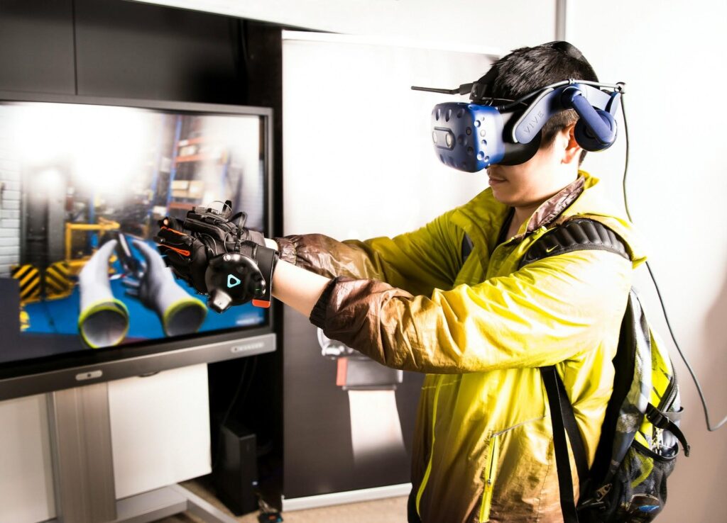 Player wearing VR headset interacts with a virtual environment—showcasing immersive gaming trend of 2026