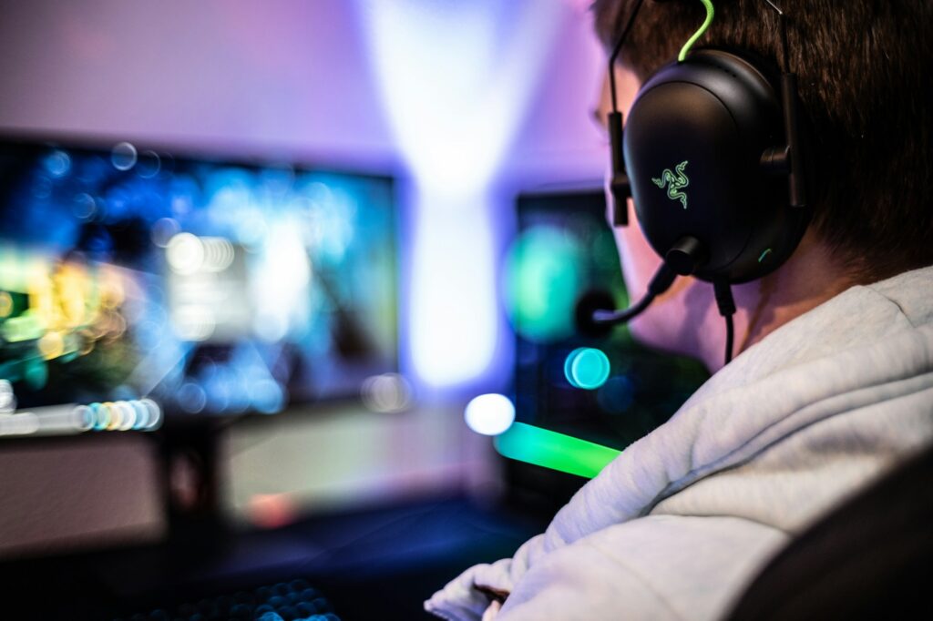 A gamer wearing a high-end headset that shows how AI-driven assistants will reshape game narratives.