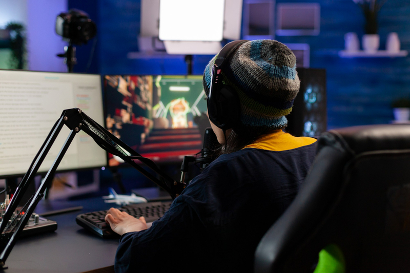 A local player enjoying an immersive gaming session at home with headset and microphone.
