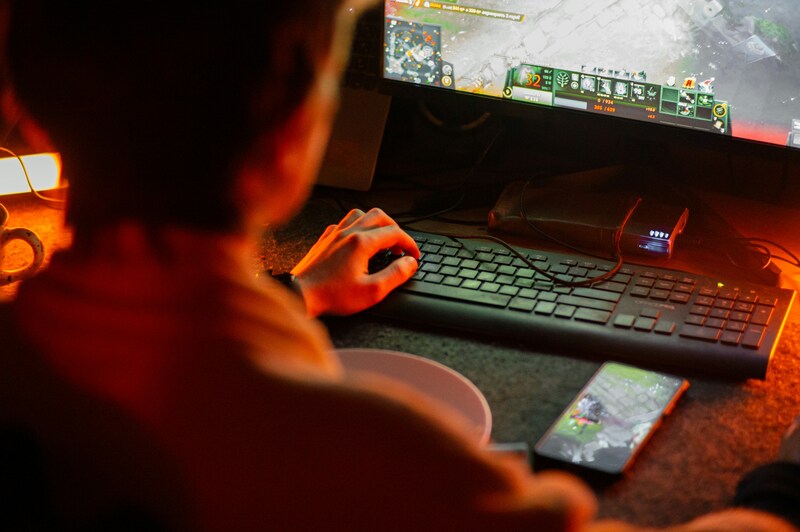 A QA tester using a machine learning system to analyze gameplay to flag performance issues and bugs.