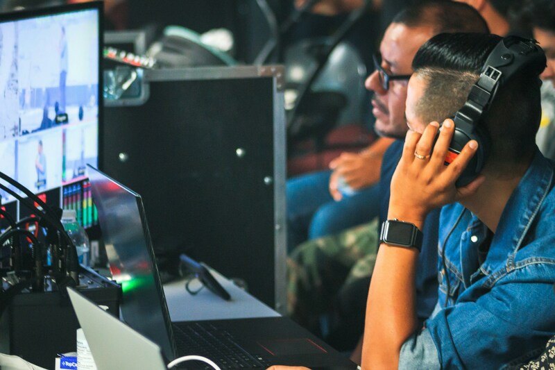 Game localization team monitoring screens during translation work.