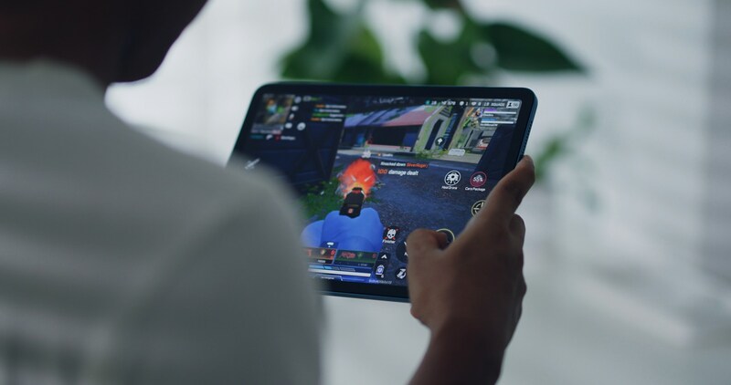 A player immersed in a video game as artificial intelligence assists with creative level design in real-time.