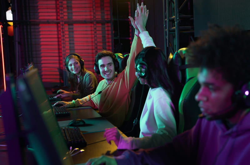 Gaming partners enjoying gameplay, reflecting eSports growth in the industry.