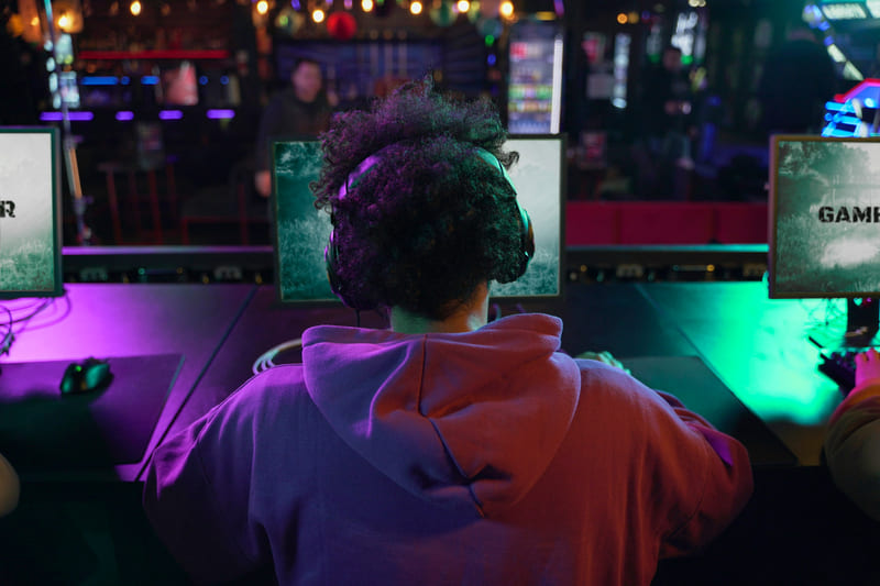 A Southeast Asia gamer immersed in a video game with native-language dialogue