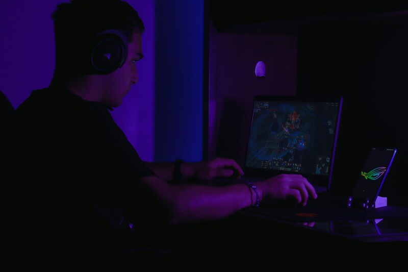 A game QA specialist at computer reviewing game build and logging issues.