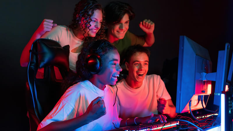 A diverse group of gamers are intensely immersed in a localized game together.