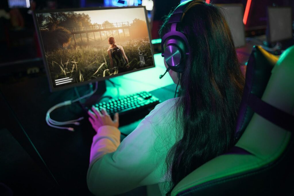 A female gamer enjoying innovative video game content on a PC