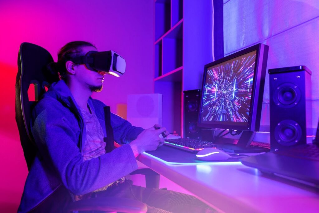 A male gamer engaged in immersive AI-enhanced VR gaming on a PC with a controller.