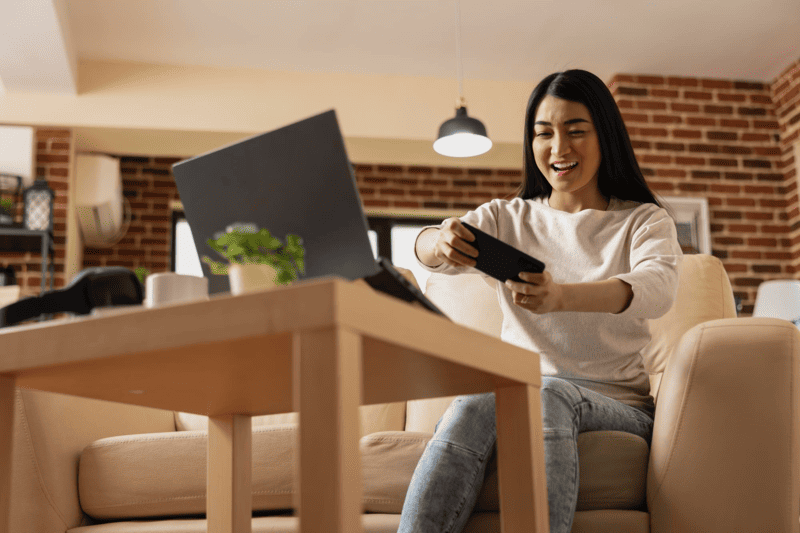 A woman playing a video game that was carefully localized for her language and culture.