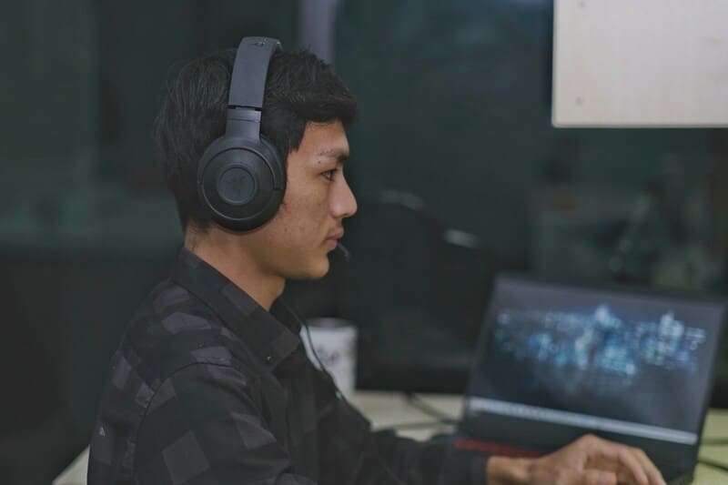 A Malay gamer enjoys a localized video game on a PC.