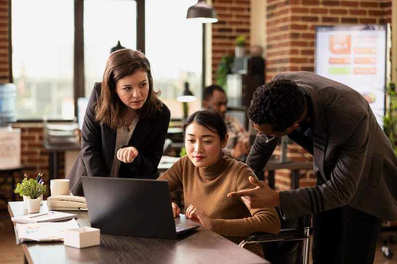 A game development team discussing AI gameplay strategies.