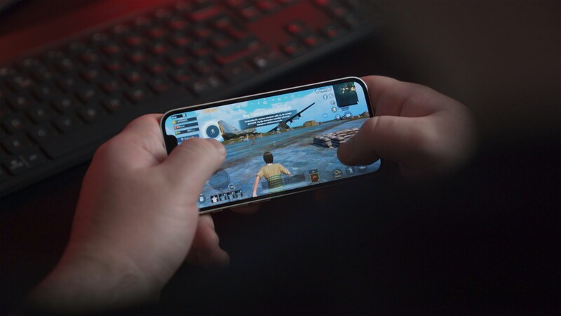 A gamer engaging with a dynamic AI-powered game on an Android phone.