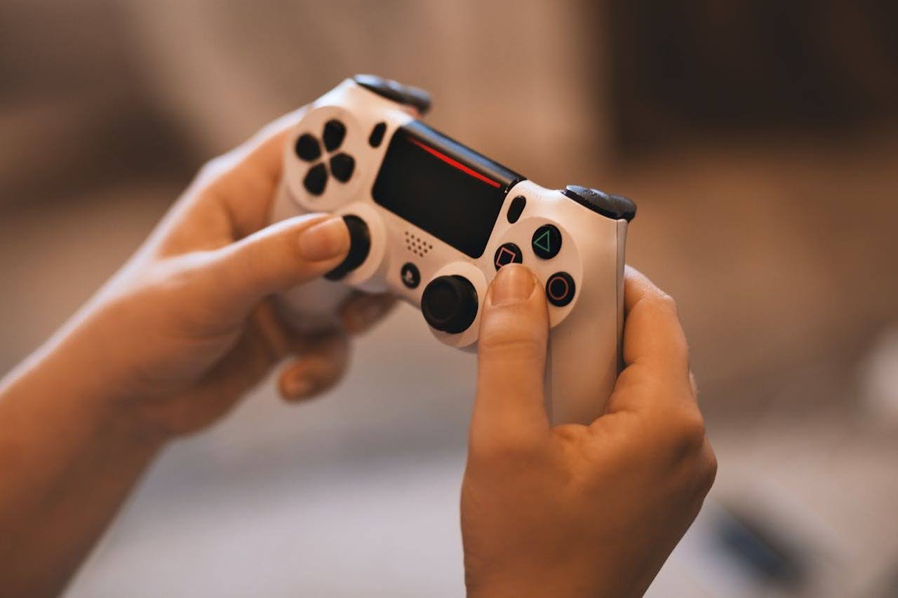 A gamer enjoying a video game using a controller, illustrating cross-platform game porting.