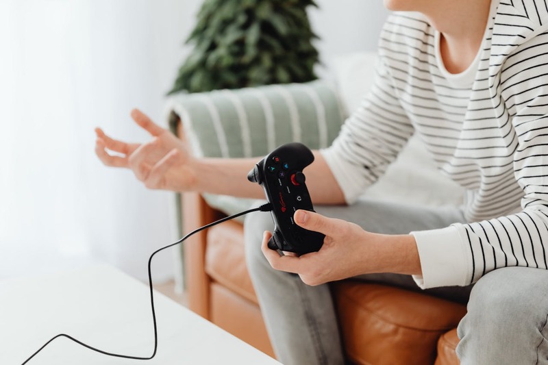 An illustration of a gamer suffering poor gameplay after porting to a different platform.