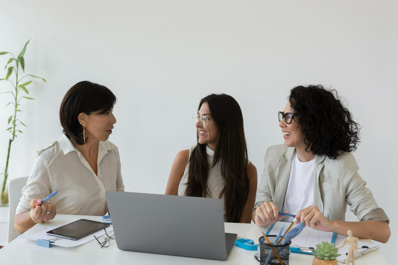 A group of women developers brainstorming and collaborating, sharing ideas from diverse perspectives.