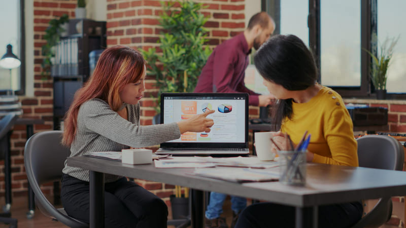 Developer team carefully analyzing IGRS regulations while adjusting game UI and content elements.