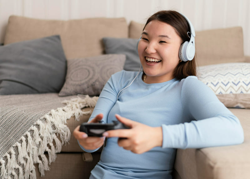 A Southeast Asian woman engages in a localized gaming experience, interacting with a story in her native language.