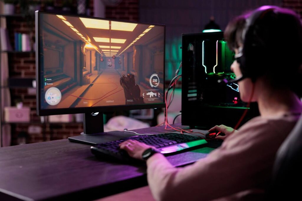 An illustration of a young gamer playing an age-appropriate PC game.