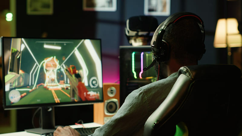 An illustration of a game tester evaluating linguistic accuracy while engaging in a video game.