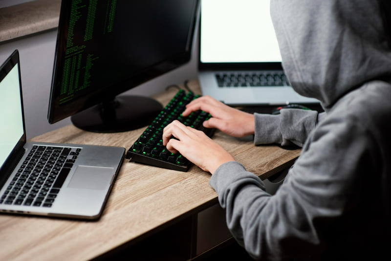 A user downloading unreleased game files from a pirate website