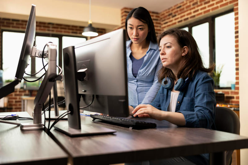 Developers reviewing an unreleased game build in a secure cloud testing environment