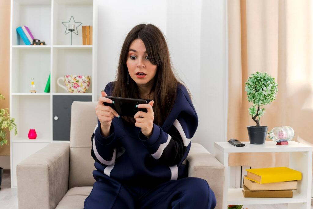 A female player expresses discomfort while playing a mobile game with inaccurate cultural representation