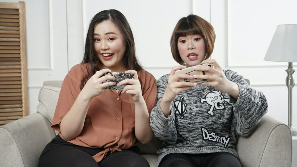 Female Malaysian gamers engage in a video game adapted with language and cultural elements.