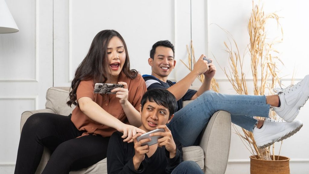 Group of players using smartphones during a shared mobile gaming session