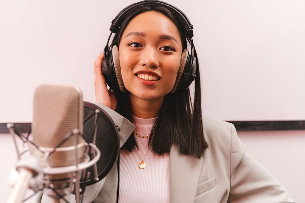 Voice actor in a recording booth for game casting, capturing authentic local accents and dialects.