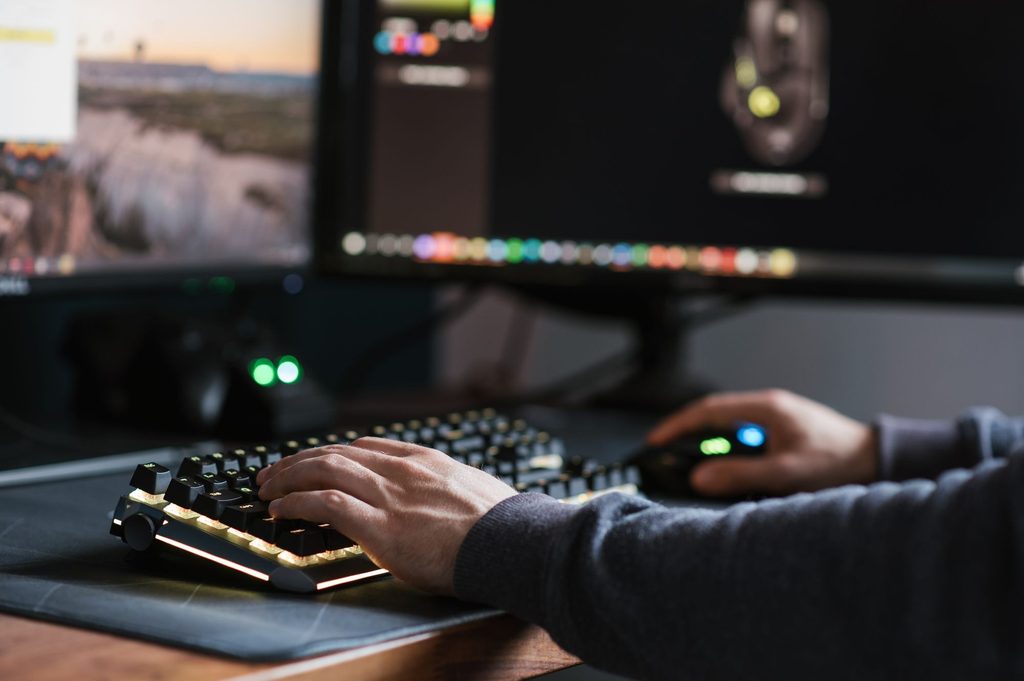 A developer testing game localization options across PC hardware setups.